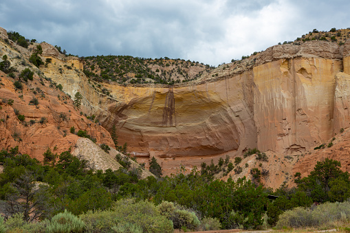 Echo Amphitheater, a roadside attraction in Abiquiu, New Mexico known for its unique echoing auditory properties, but also supposedly carries the stains of wild west killings. Made of sandstone with stains in the rock. Good Hiking and picnic area.