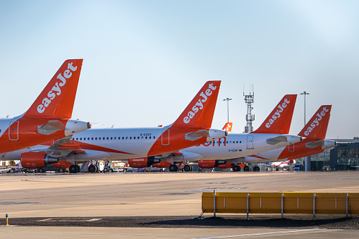 Gatwick, UK- July 9,2023: Airplanes of easyjet staying at Gatwick airport. EasyJet plc (styled as easyJet) is a British multinational low-cost airline group.