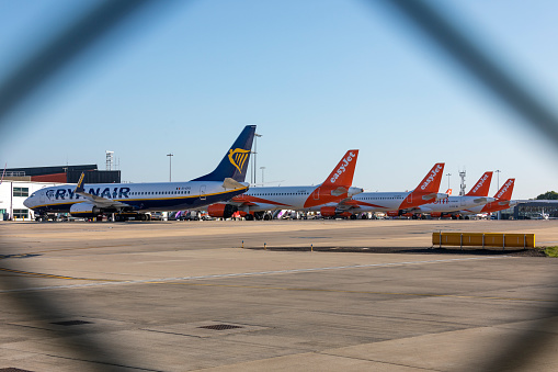 6th May, 2020 - Luton, UK: Airlines have been forced to halt their operation and ground their aircraft during the 2020 Coronavirus pandemic.  This image shows different airlines and aircraft parked up at Luton Airport.