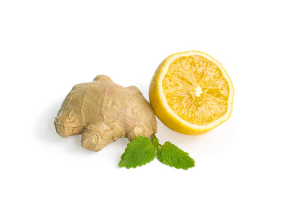 istock fresh ginger root with lemon and mint or mellis leaves on a white isolated background 1223251764