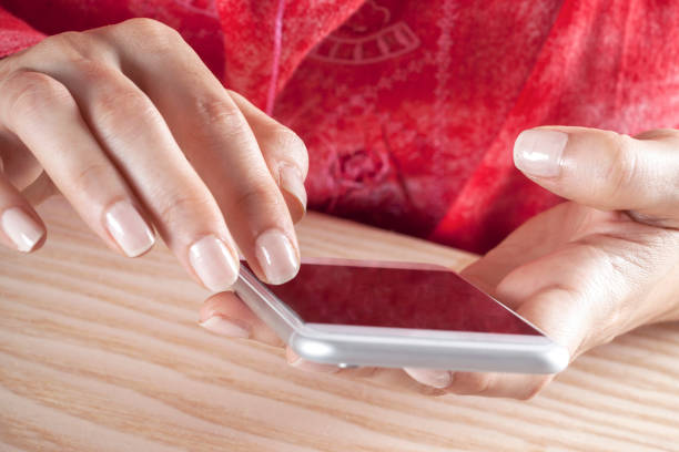 istock woman hand holding a mobile phone 1223251831