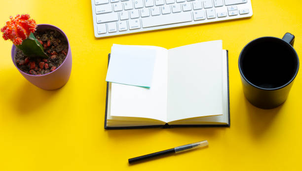 istock Office yellow workplace backdrop with supplies and computer. Flat lay. Top view with copy space for your goals 1223252920