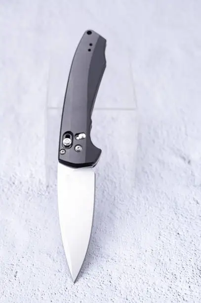 Photo of The knife in an upright position is inclined at an angle.