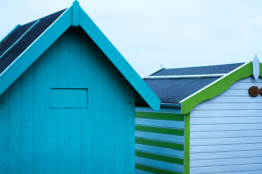 Colourful Southend-on-sea beach huts. Southend-on-Sea is a seaside resort town, in Essex, England. It is between Rochford in the North and Castle Point to the West. It is home to the longest leisure pier in the world, Southend Pier. The Southend Pier is a major landmark extending 1.34 miles (2.16 km) into the Thames Estuary and is the longest pleasure pier in the world