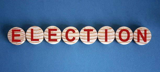 istock The word 'election' on wooden circles on blue table. 1223255862