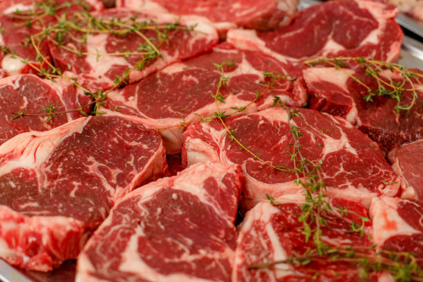 istock raw steaks with rosemary for cooking 1223256270