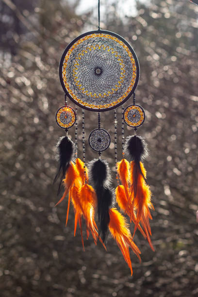 istock Handmade dream catcher with feathers threads and beads rope hanging 1223256514
