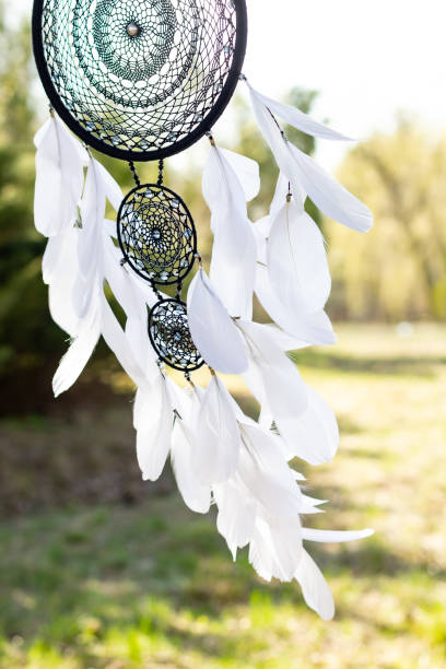 istock Handmade dream catcher with feathers threads and beads rope hanging 1223256515