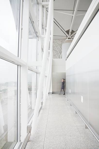 istock Stewardess entering a corridor of office building 122325782
