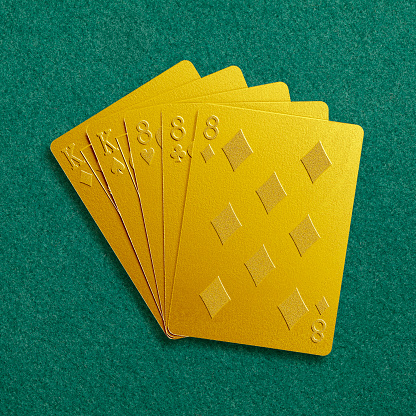 Poker cards on green cloth