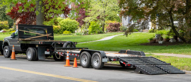 landscaping truck in residential neighborhood Landscaping truck with empty flatbed trailer with ramp parked on residential neighborhood street. trailer stock pictures, royalty-free photos & images