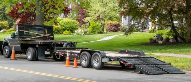 Photo of landscaping truck in residential neighborhood