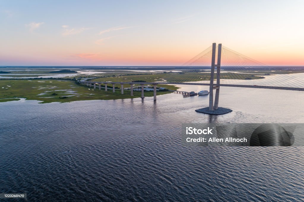 Drone View of Georgia River and Bridge View to the southwest of the Sidney Lanier Bridge, which spans the East River just outside of Brunswick, Georgia. Georgia - US State Stock Photo