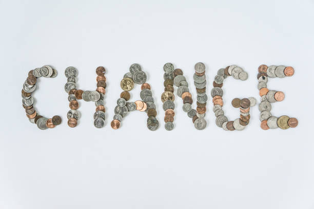 istock Coins isolated on solid white background spelling the word Change from loose coin change. Blank empty room space for text or copy. Financial mockup concept on flat lay backdrop with unique lettering. 1223260486