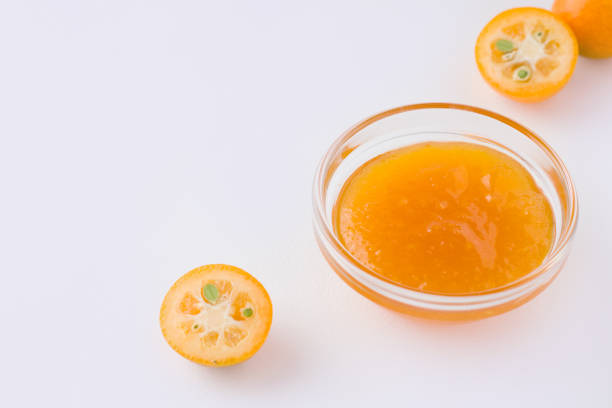 istock kumquat tropical citrus fruit jam on white plate next to fresh ingredients 1223262368