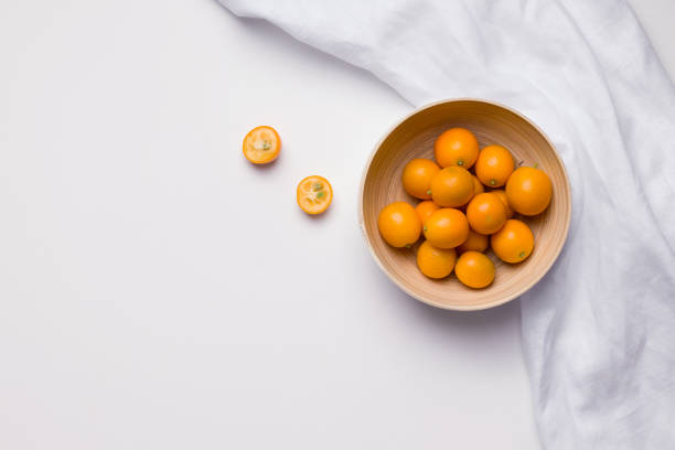 istock kumquat citrus in Minsk from bamboo on a white background. copy space 1223262420