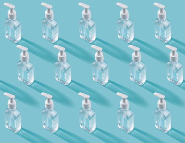 istock Trendy pattern with mask and antiseptic on a blue background 1223263779