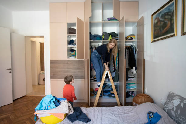 istock Woman reorganizing her wardrobe 1223266097