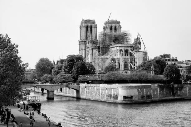 Notre Dame Cathedral in Paris after the fire destroyed the whole roof in 15 April 2019. The works have started, with a scaffolding and a crane. Paris in France, April 18, 2019