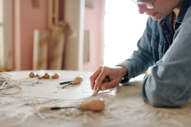 istock Close up of woman doing linocut technique with copy space 1223266797