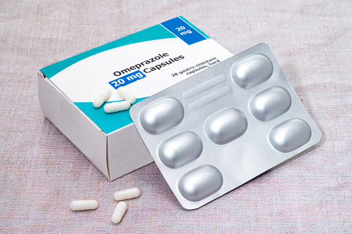 A box and blister pack of generic  Omeprazole pills