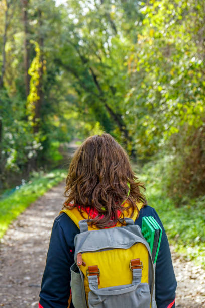 istock woman walking on the path. 1223269361