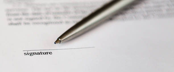 istock Space for signature on document and silver boll pen 1223269758