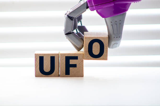 istock Ufo text word crossword. Alphabet letter blocks game texture background. 1223269763