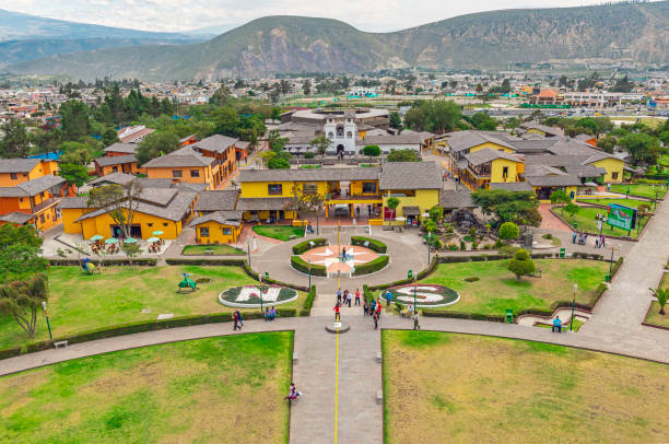 Equator Line, Quito, Ecuador Aerial view from Equatorial line monument and the Andes mountains in Quito with tourists walking on the site, Ecuador. equator line stock pictures, royalty-free photos & images