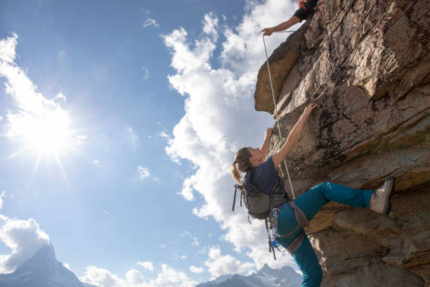 istock Father and daughter belay each other mountain climbing 1223269814