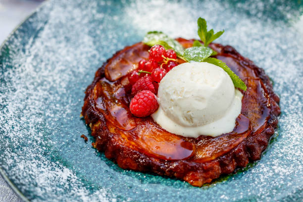 istock Delicious dessert, Belgian waffle with berries, ice cream and mint on a white table 1223270007