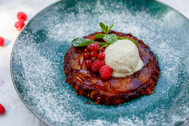 istock Delicious dessert, Belgian waffle with berries, ice cream and mint on a white table 1223270363