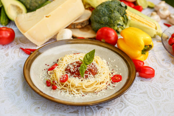 istock Pasta bolognese with minced meat and tomatoes with greens 1223270837