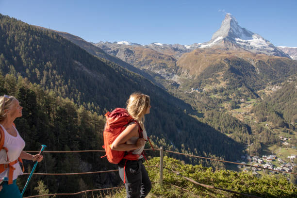 istock Mother and daughter hike along footpath 1223272300