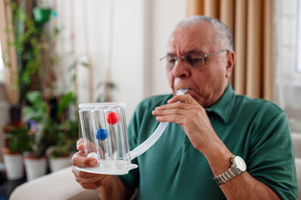 patient measures his own lung capacity patient measures his own lung capacity heart disease photos stock pictures, royalty-free photos & images