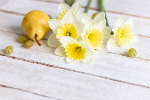 yellow food and flowers on white