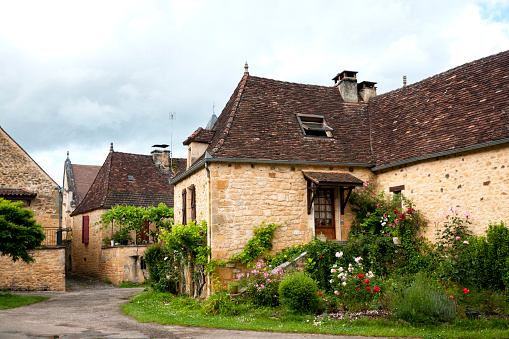 Village in Lot, in Perigord, in the South West of France. The village (Payrignac ?) is typical with yellow stone house. Périgord in France. June 13th, 2016