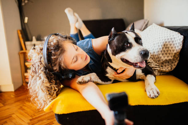 istock Woman playing with Dog 1223276378