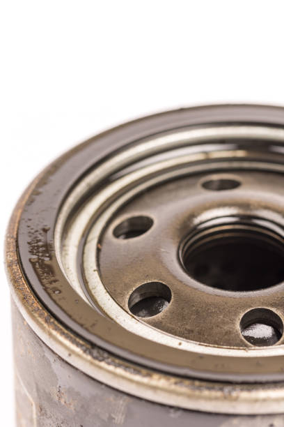 istock Macro close up car oil filter over white background 1223276638