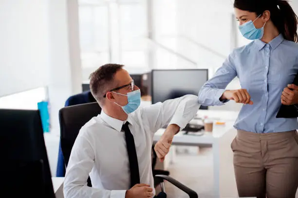 Photo of Business people greeting during COVID-19 pandemic stock photo