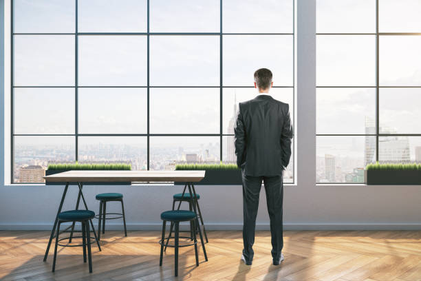 istock Businessman in minimalistic freelancer space 1223277510