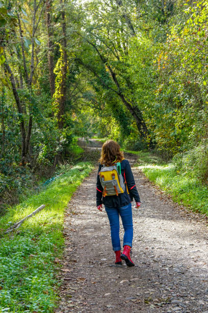 istock woman walking on the path. 1223279053