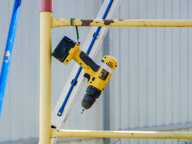 istock A yellow cordless screwdriver hangs on a scaffold bar. 1223281061