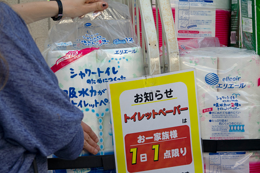 Tokyo, Japan - May 01, 2020: People buying toilet paper, Panic buying, Notice on the shelf: Only 1 Item per Customer.