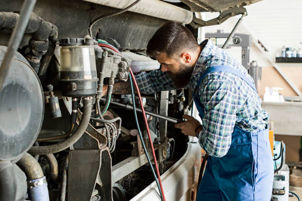 istock Caucasian Vehicles Technician working on a bus charging air conditioning unit 1223281974