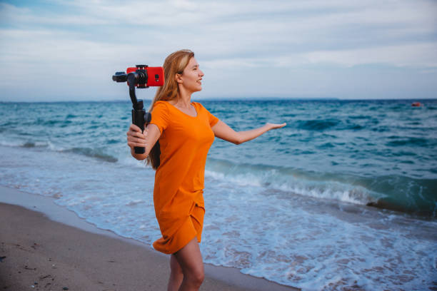 istock Woman using mobile phone and makes a vlog video 1223283244
