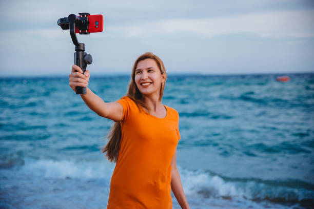 istock Woman using mobile phone and makes a vlog video 1223283249