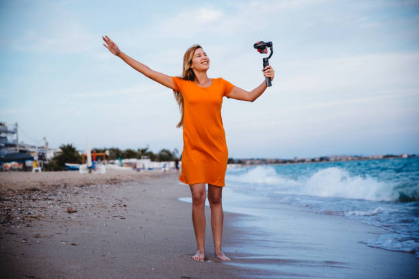 istock Woman using mobile phone and makes a vlog video 1223283271