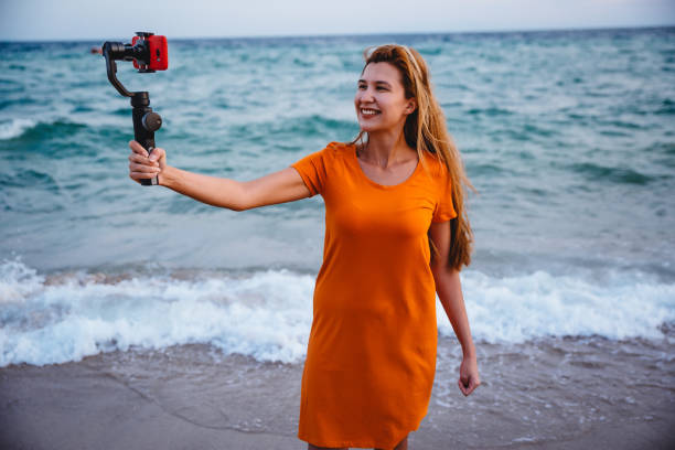 istock Woman vlogging from the seaside 1223283930
