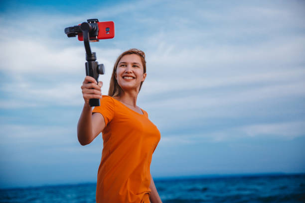 istock Woman vlogging from the seaside 1223283968